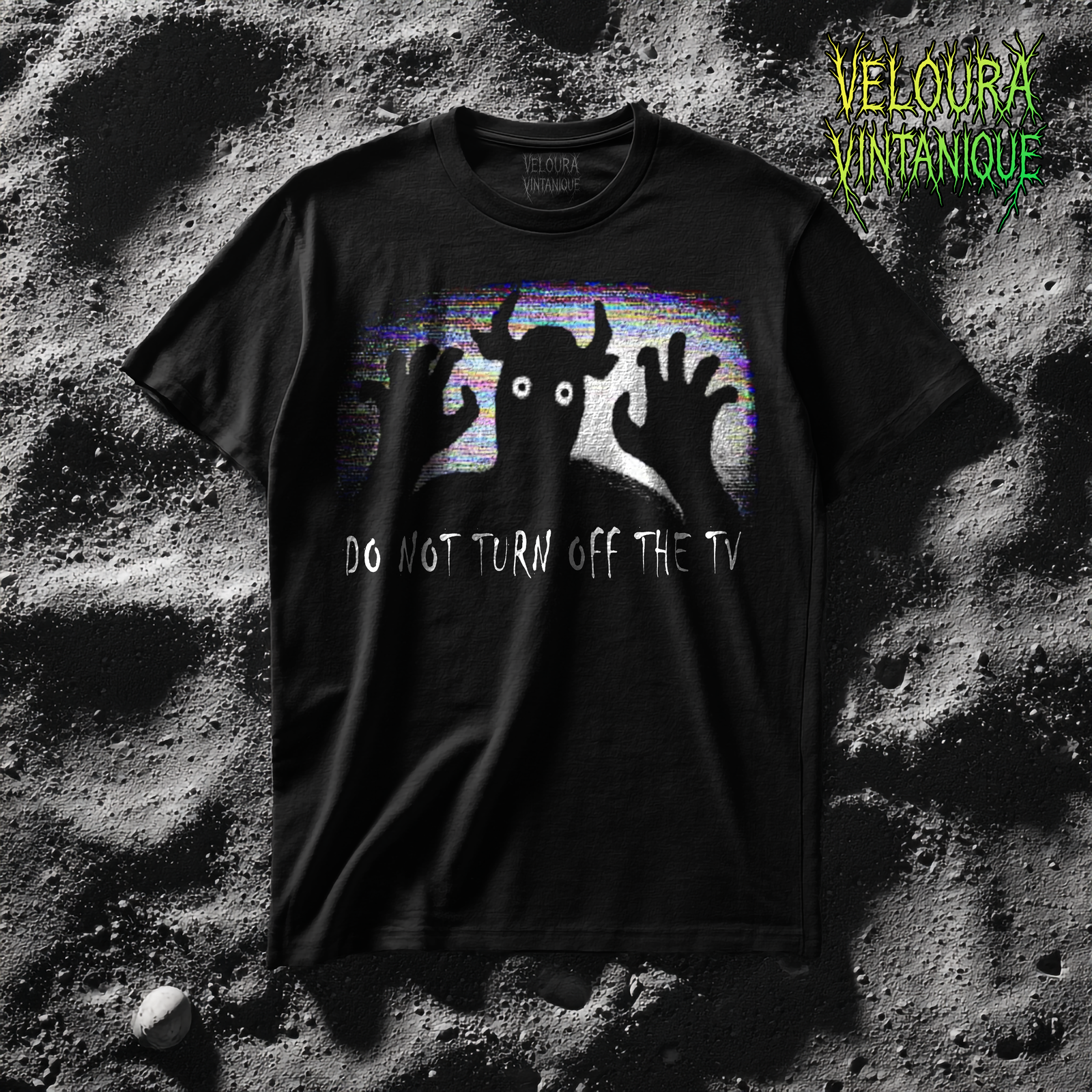 Scary analog horror t-shirt featuring a disturbing creature behind a static screen and watching directly from there. Beneath it reads "DO NOT TURN OFF THE TV"