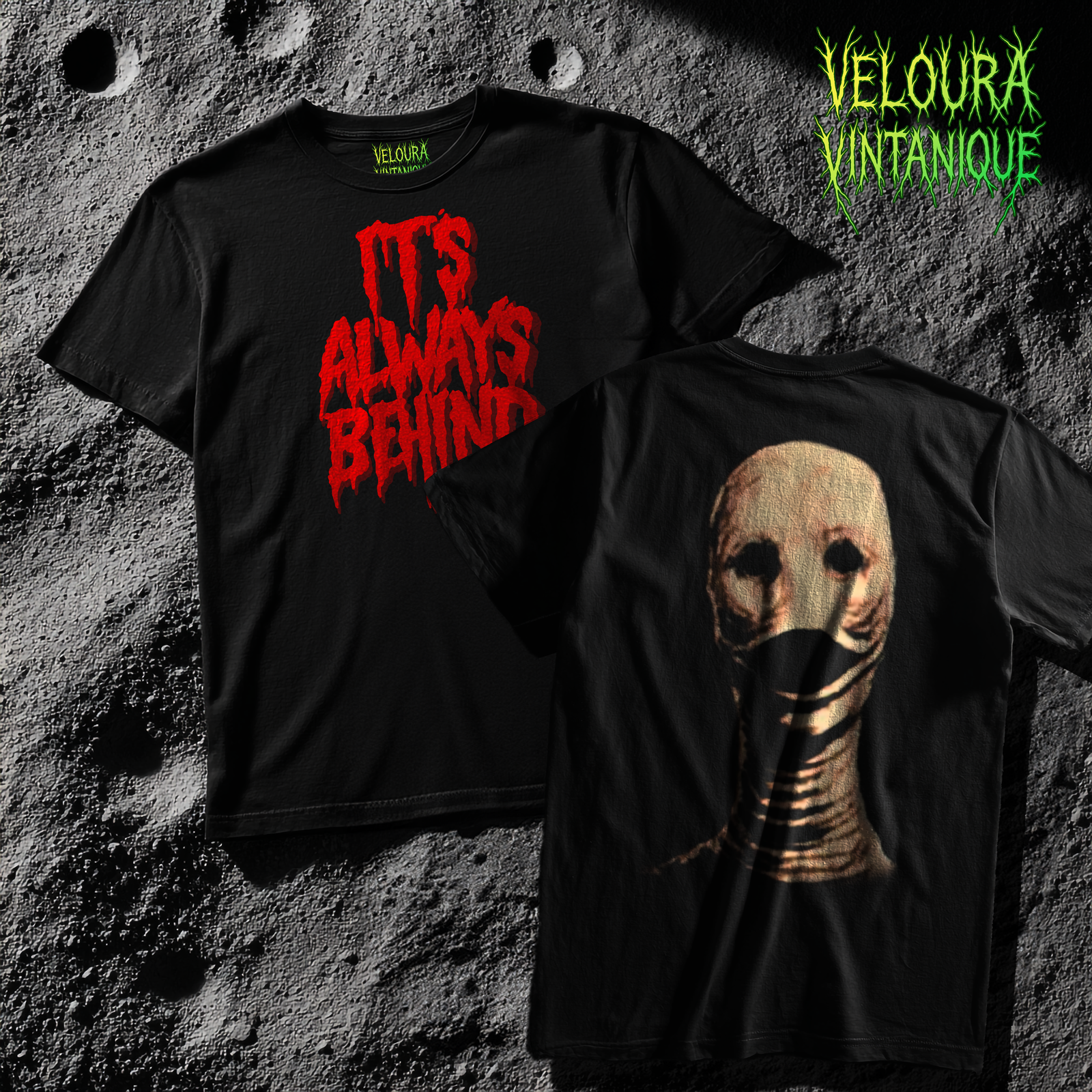 This T-shirt features a terrifying analog-horror inspired design. On the front, bold jagged red letters read “IT’S ALWAYS BEHIND”, dripping as if written in blood. On the back, a haunting image of the “Worm Man” is printed: a pale, flesh-toned head with hollow black eyes and a distorted, wormlike neck wrapping downward, its mouth sealed in grotesque folds of skin. The eerie contrast between the blood-red typography and the unsettling humanoid creature creates a nightmarish statement piece for horror fans.