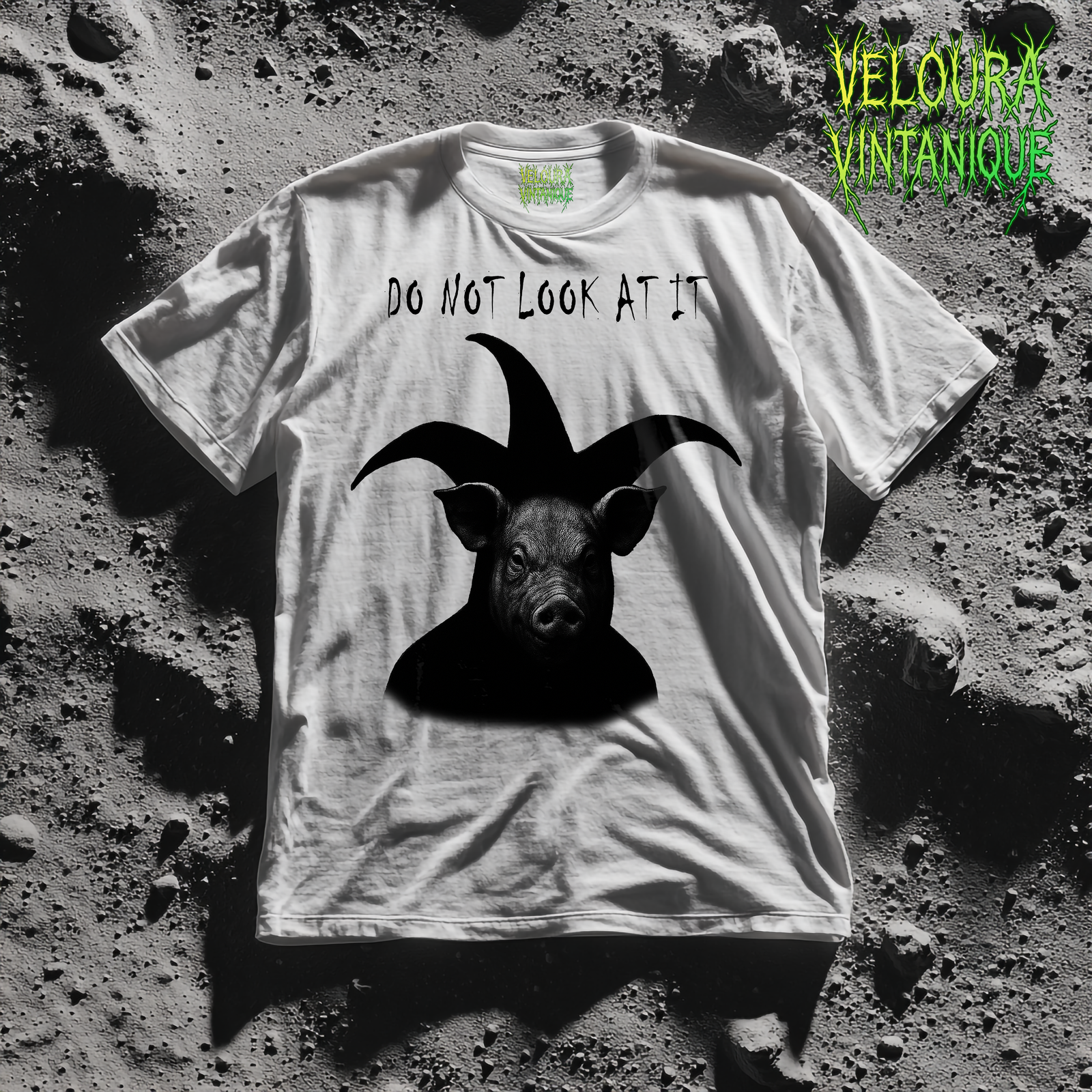 Weird analog horror shirt featuring a design of a pig with jester style horns on its head. This t-shirt definitely gives a spooky and weird vibe.