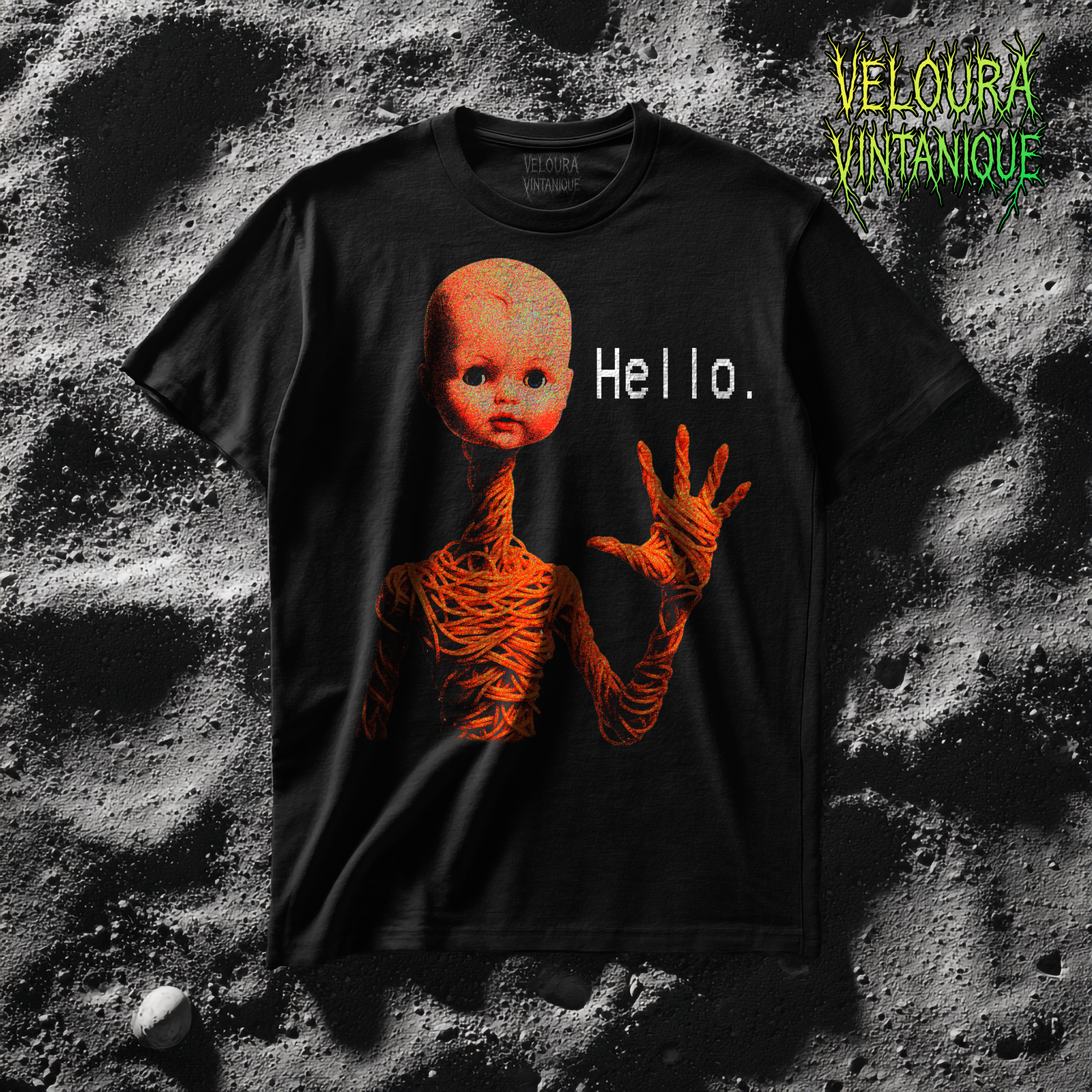 Black t-shirt with creepy doll and weird spaghetti combination creature waving and saying hello. Distorted look, great for analog horror fans and horror fans in general.