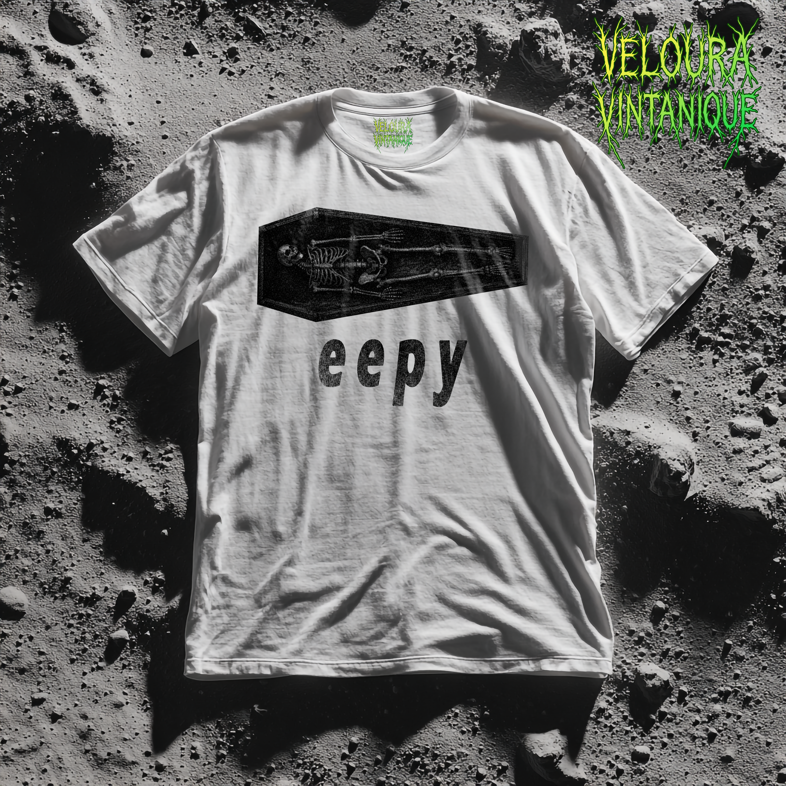 This T-shirt features a minimalist yet eerie illustration of a skeleton lying inside a coffin, printed in a rough, grainy black texture for a worn vintage look. Beneath the image, the word “eepy” adds dark humor, blending sleepy-core internet culture with subtle horror aesthetics. The contrast between the calm, resting pose and the symbolism of the coffin creates a quietly unsettling but playful design. Perfect for fans of ironic horror, spooky humor, skeleton art, and low-key creepy fashion.