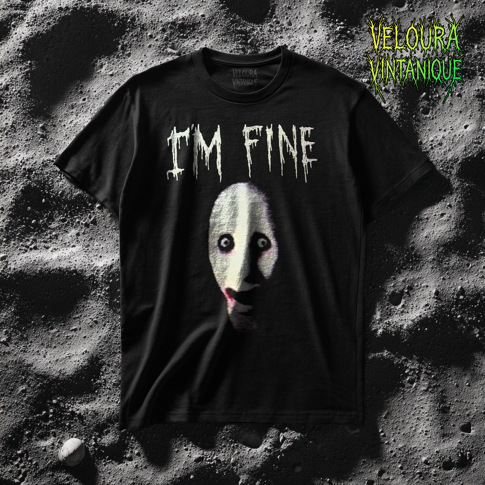 This dark horror t-shirt features the unsettling phrase “I’m Fine” in dripping, distressed lettering above a distorted pale mask-like face with haunting wide eyes and a twisted expression. The gritty, shadowed texture enhances the psychological horror aesthetic, creating a design that feels eerie, surreal, and deliberately uncomfortable. Perfect for fans of analog horror, creepy artwork, emotional irony, and bold statement tees.