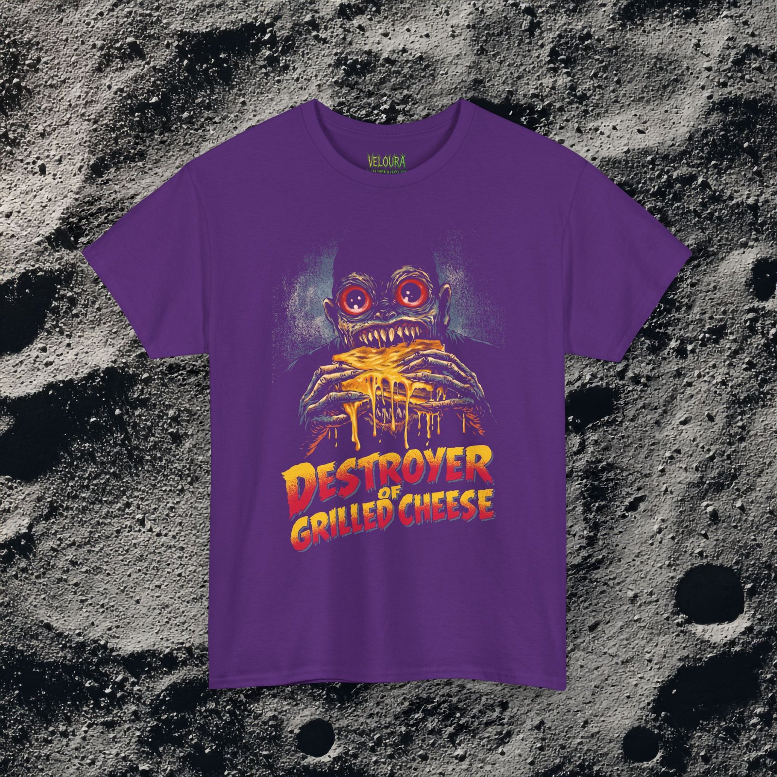 This bold and hilarious T-shirt features a monstrous creature with glowing red eyes devouring a dripping, melty grilled cheese sandwich, paired with the phrase βDestroyer of Grilled Cheese.β The design blends horror aesthetics with dark humor, making it perfect for food lovers who enjoy edgy, meme-style graphics. With its vivid colors, exaggerated expression, and gooey cheese details, this shirt instantly grabs attention and sparks laughs. Ideal for fans of quirky humor, creepy art, late-night snacks, and unapologetic comfort food obsession.