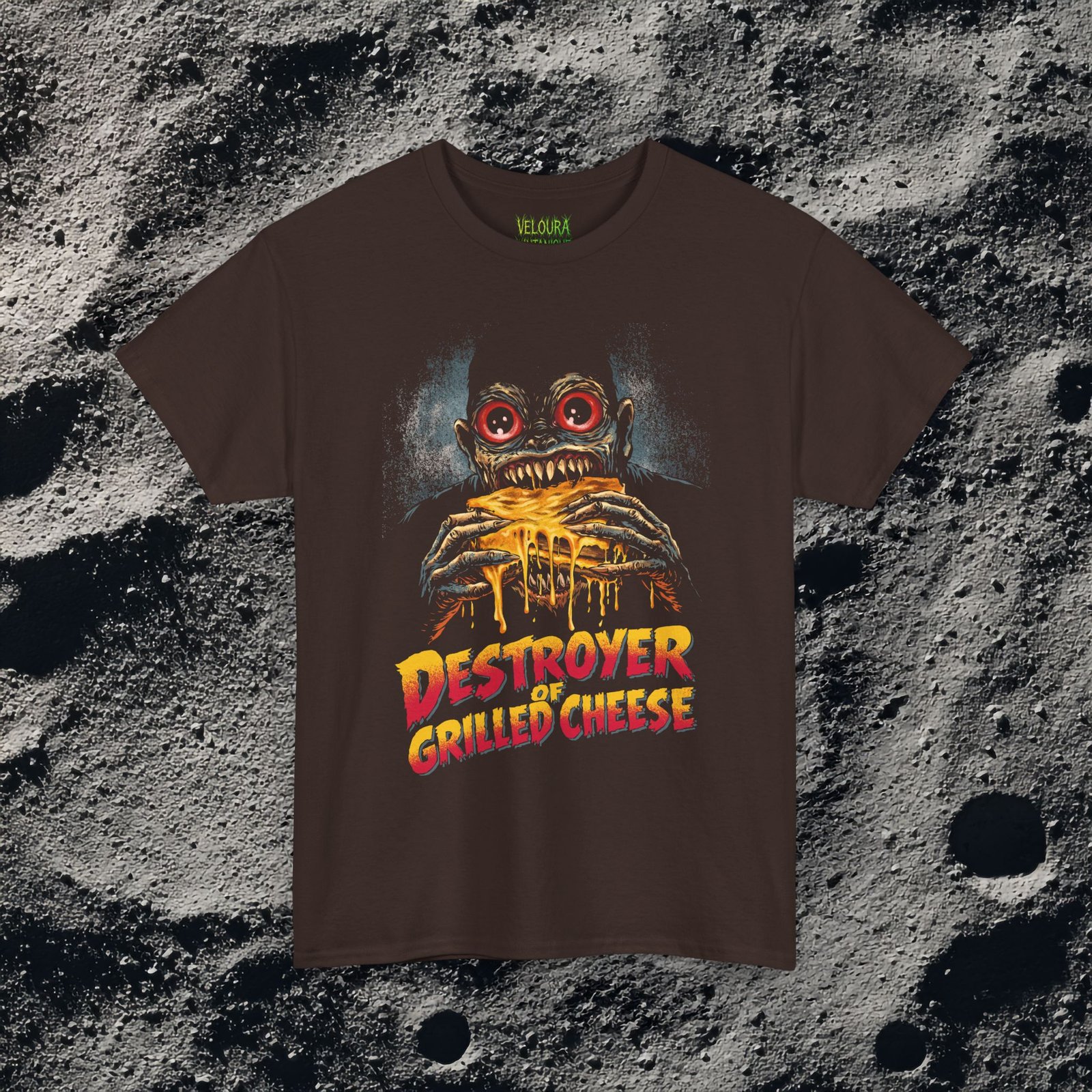 This bold and hilarious T-shirt features a monstrous creature with glowing red eyes devouring a dripping, melty grilled cheese sandwich, paired with the phrase βDestroyer of Grilled Cheese.β The design blends horror aesthetics with dark humor, making it perfect for food lovers who enjoy edgy, meme-style graphics. With its vivid colors, exaggerated expression, and gooey cheese details, this shirt instantly grabs attention and sparks laughs. Ideal for fans of quirky humor, creepy art, late-night snacks, and unapologetic comfort food obsession.