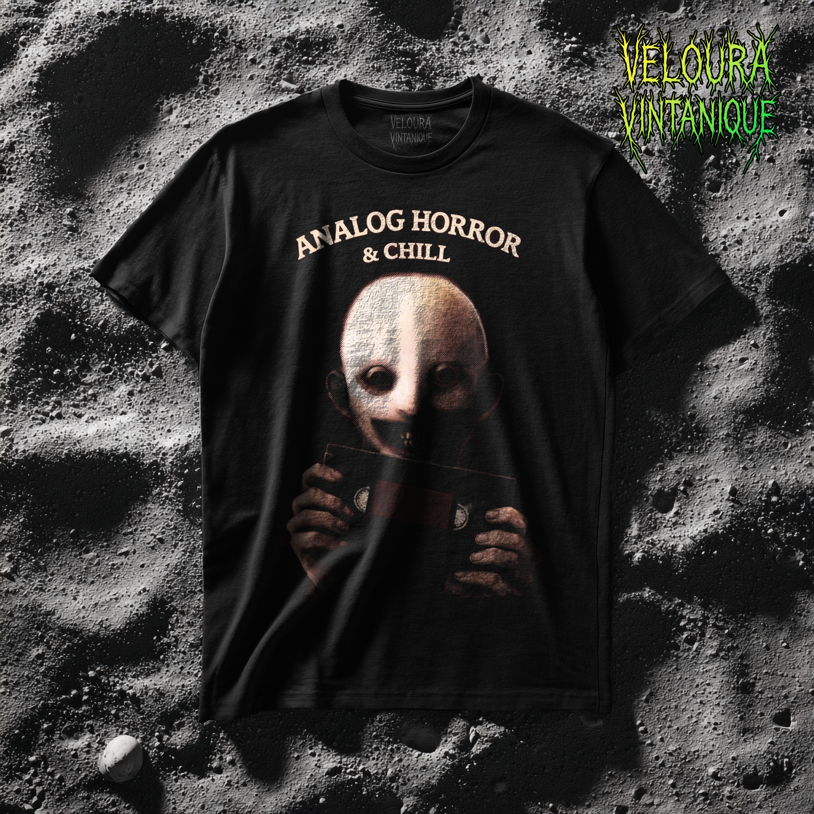 This eerie design features a pale, unsettling figure holding a VHS cassette, paired with the phrase “Analog Horror & Chill.” The dark lighting, grainy textures, and muted tones create a strong analog horror and retro found-footage aesthetic. The character’s hollow eyes and subtle smile add an extra layer of psychological unease, making this design perfect for fans of creepy visuals, weirdcore art, and retro horror culture. A must-have for anyone who loves horror with nostalgic VHS vibes.