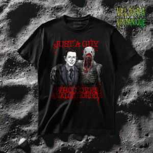 This striking analog horror T-shirt features a disturbing yet oddly wholesome scene of a smiling man standing arm-in-arm with a terrifying creature, paired with the bold text: “Just a Guy Who Loves Analog Horror.” The contrast between friendly and grotesque gives this design its unsettling charm, inspired by VHS-era horror, liminal aesthetics, and found-footage style visuals. Perfect for fans of creepy art, surreal horror, internet horror culture, and dark humor. A must-have for anyone who loves weird, unsettling, and conversation-starting designs.