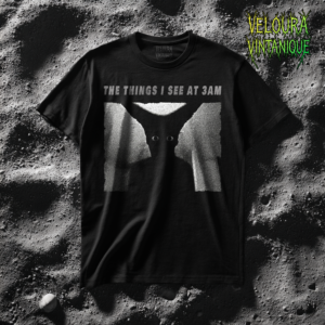 This horror T-shirt features a haunting shadow figure with glowing eyes emerging from darkness beneath the phrase “THE THINGS I SEE AT 3AM.” The grainy, analog-style texture creates a disturbing late-night nightmare atmosphere. The high-contrast black and white composition enhances the eerie silhouette, making it perfect for fans of analog horror, psychological horror, creepypasta aesthetics, and unsettling minimalist graphic designs inspired by sleep paralysis and insomnia.