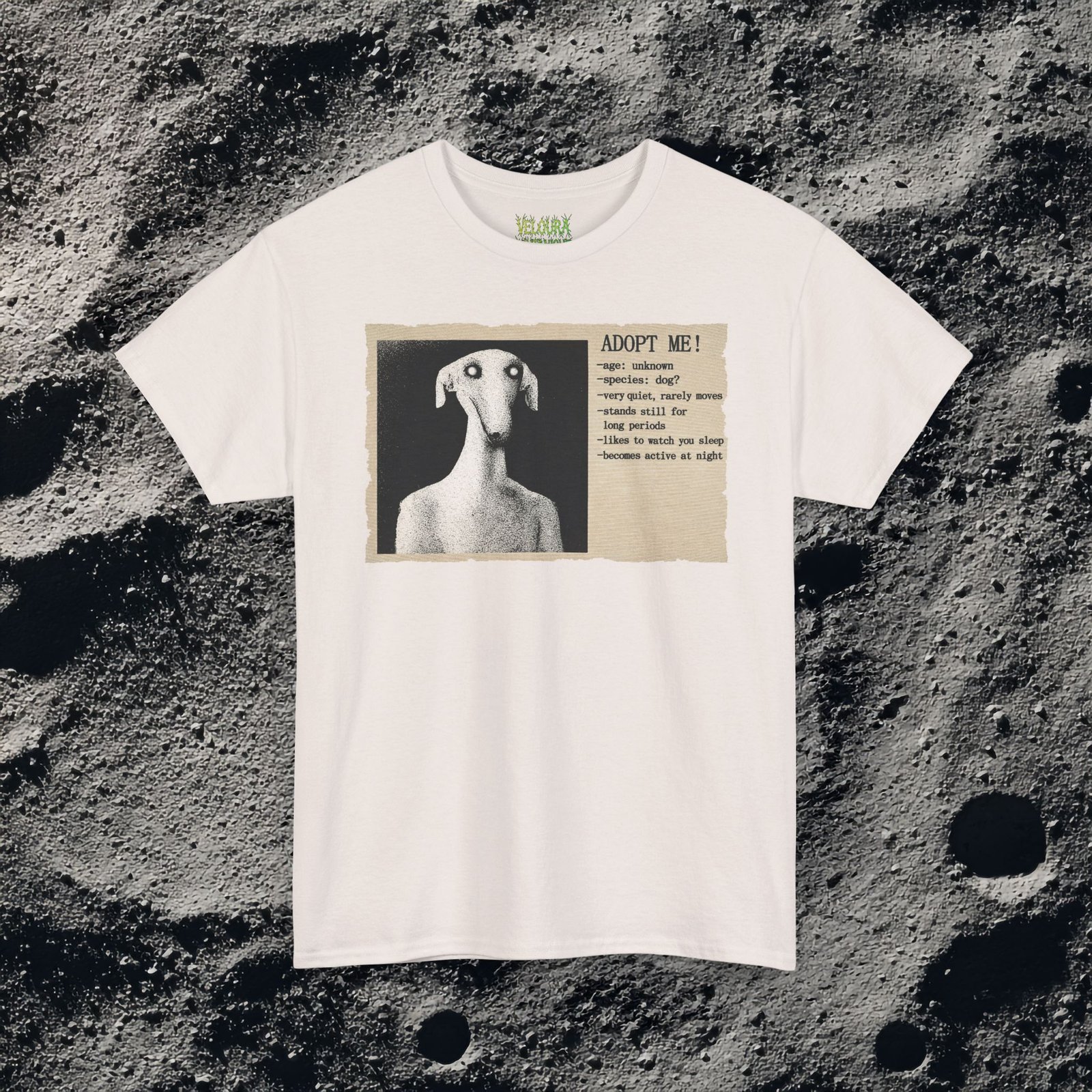 This eerie analog horror-inspired design features a distorted humanoid dog figure with glowing eyes, presented in a grainy black-and-white style. The artwork mimics an old, unsettling adoption poster with the headline “ADOPT ME!” followed by disturbing details like “age: unknown,” “species: dog?” and “likes to watch you sleep.” The textured paper background and vintage print effect enhance the unsettling atmosphere, making this design perfect for fans of analog horror, liminal spaces, and creepy surreal art.