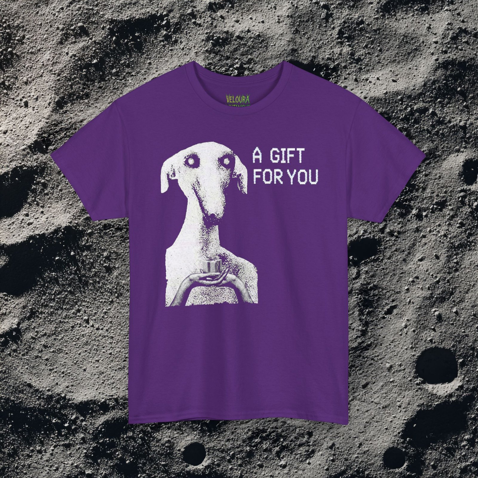 This unsettling horror T-shirt features a strange, eerie dog-like creature with hollow eyes and an unnatural expression, holding a small gift box in its hands. The grainy black-and-white texture creates a disturbing analog horror aesthetic reminiscent of cursed TV broadcasts and creepypasta imagery. The phrase “A GIFT FOR YOU” appears beside the figure in glitch-style typography, adding a mysterious and ominous tone. Perfect for fans of analog horror, creepy art, and dark streetwear.