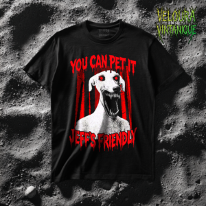 This creepy horror T-shirt features a terrifying dog-like creature with glowing red eyes and a wide mouth full of sharp teeth. The disturbing figure appears against a dark forest background, while dripping red horror-style text reads “YOU CAN PET IT” and “JEFF’S FRIENDLY.” The gritty analog horror art style creates an unsettling atmosphere reminiscent of internet creepypasta and cursed VHS aesthetics. The bold red and black contrast gives the design a striking and sinister look.