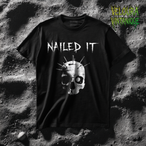 This dark humor horror T-shirt features a haunting skull pierced with multiple nails, creating a striking and eerie visual. Above the skull, the phrase “NAILED IT” appears in sharp horror-style typography, turning the familiar phrase into a twisted gothic joke. The gritty monochrome artwork gives the design a raw underground horror aesthetic that stands out on dark fabric. Perfect for fans of gothic fashion, horror art, Halloween themes, and edgy dark humor designs.