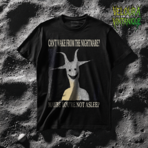 This eerie horror T-shirt features a strange, surreal creature with long twisted horns and a haunting smile emerging from the darkness. The unsettling figure is framed by the phrases “CAN’T WAKE FROM THE NIGHTMARE?” and “MAYBE YOU’RE NOT ASLEEP,” creating a disturbing dreamlike atmosphere. The gritty analog-style texture gives the artwork a creepy late-night broadcast aesthetic inspired by dreamcore and analog horror visuals. Perfect for fans of creepy art, psychological horror, and dark alternative fashion.